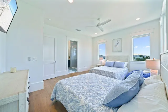 a view of a kitchen with furniture and wooden floor