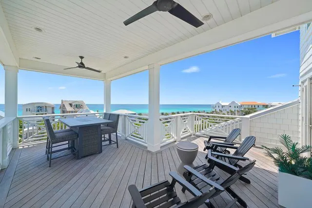 a living room with furniture a floor to ceiling window and a floor to ceiling window