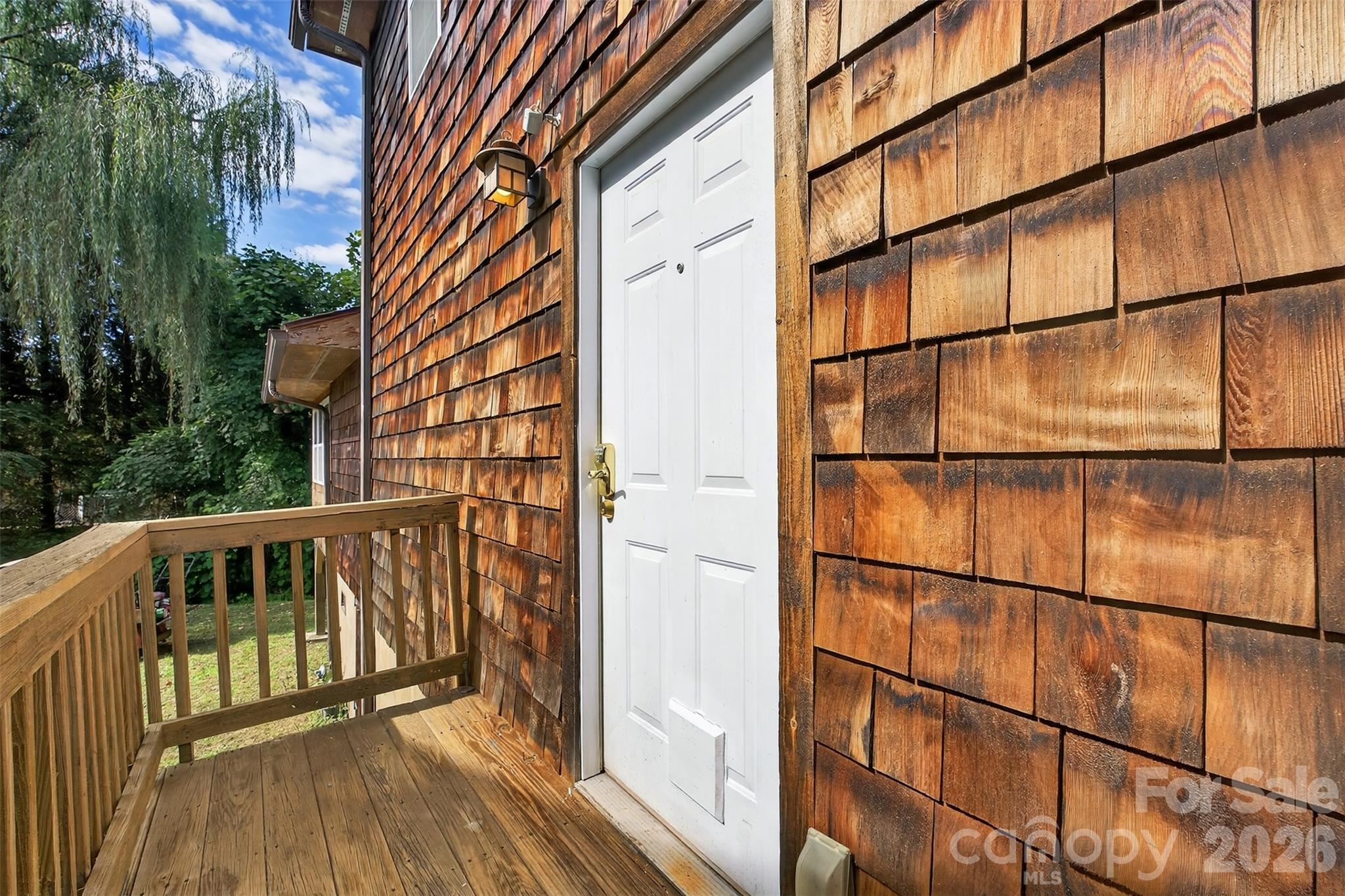 160 East Howard Street Tryon, NC 28782 - Photo 40 of 48 a view of a balcony with wooden floor