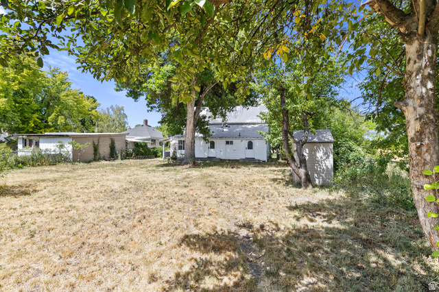 148 South 300 East Logan, UT 84321 - Photo 21 of 29 Expansive rear yard with mature trees providing natural shade
