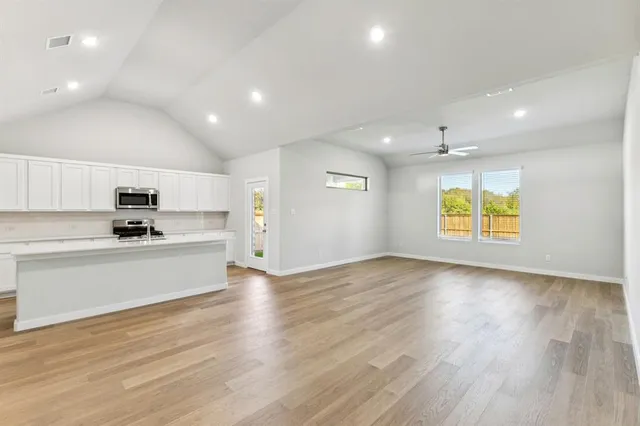 a view of kitchen with wooden floor and window