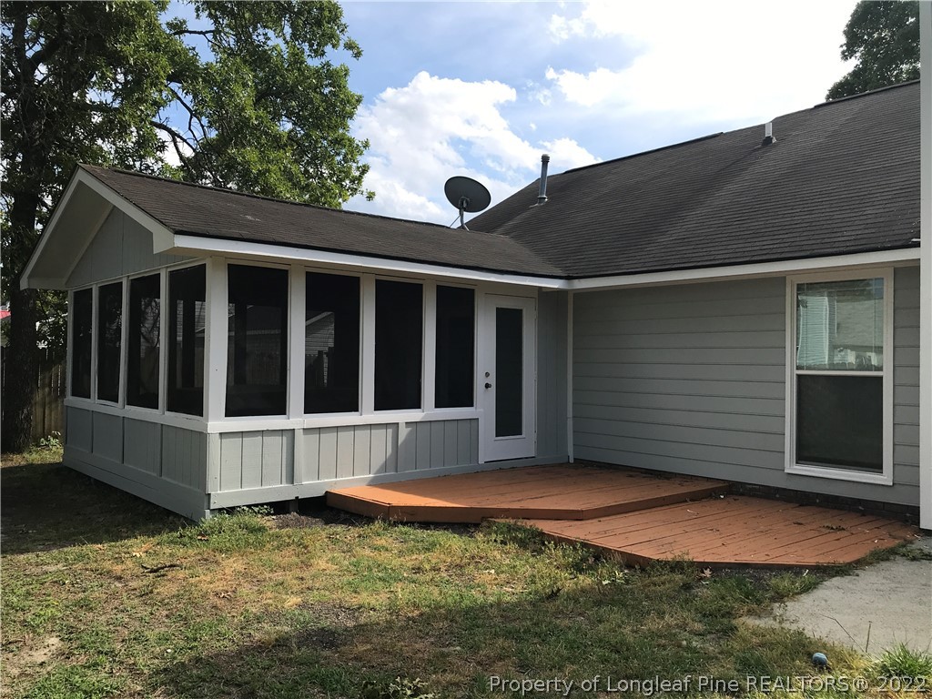 713 Rim Road Fayetteville, NC 28314 - Photo 15 of 16 a view of a house with backyard and porch