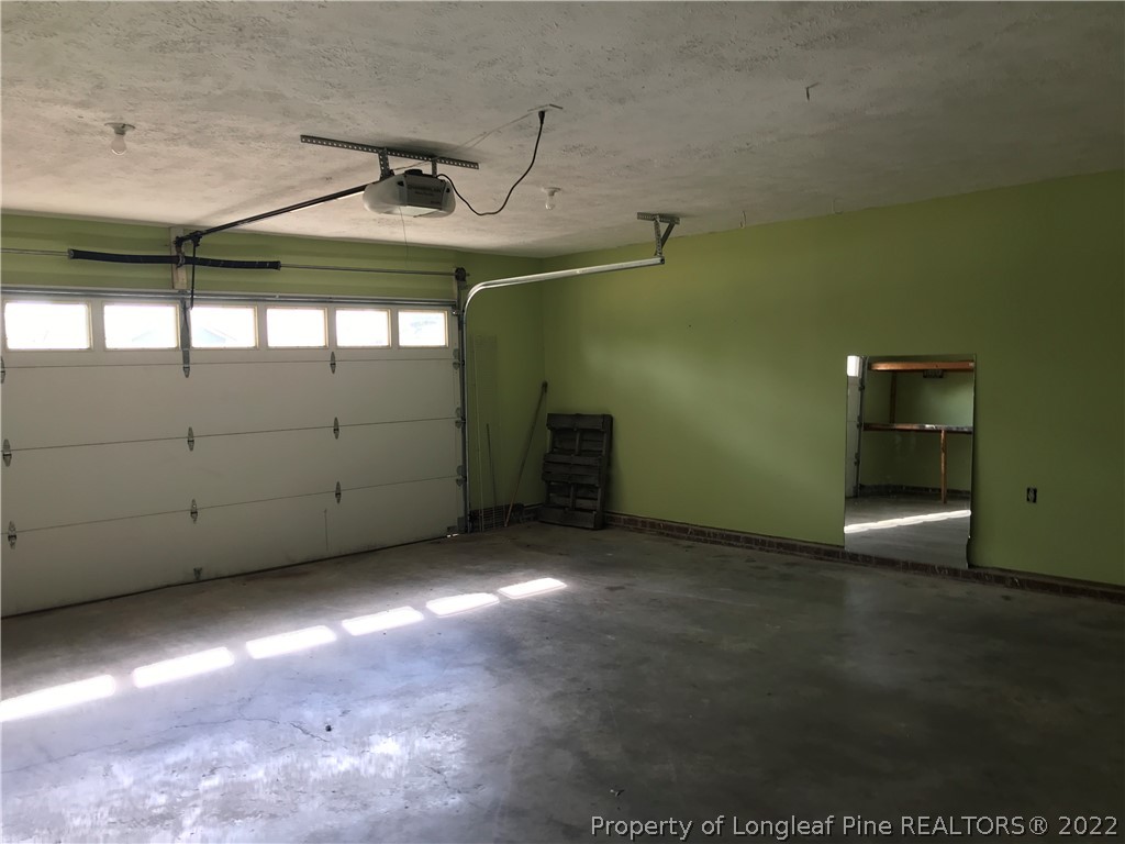 713 Rim Road Fayetteville, NC 28314 - Photo 16 of 16 a view of a room with a ceiling fan and window