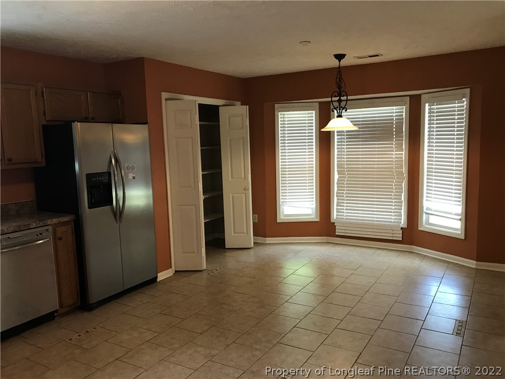 713 Rim Road Fayetteville, NC 28314 - Photo 3 of 16 a view of an empty room with a kitchen