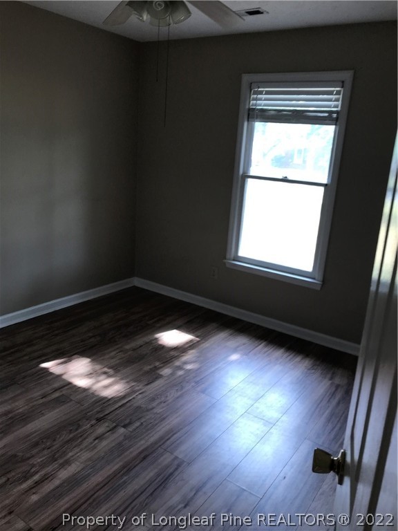 713 Rim Road Fayetteville, NC 28314 - Photo 9 of 16 a view of empty room with wooden floor and fan