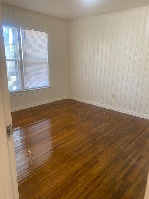 3912 North 22nd Street Waco, TX 76708 - Photo 11 of 16 a view of an empty room with wooden floor and a window