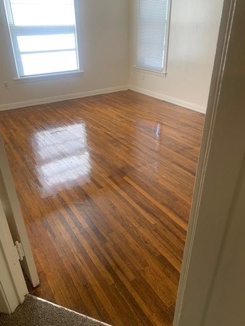3912 North 22nd Street Waco, TX 76708 - Photo 7 of 16 an empty room with wooden floor and windows