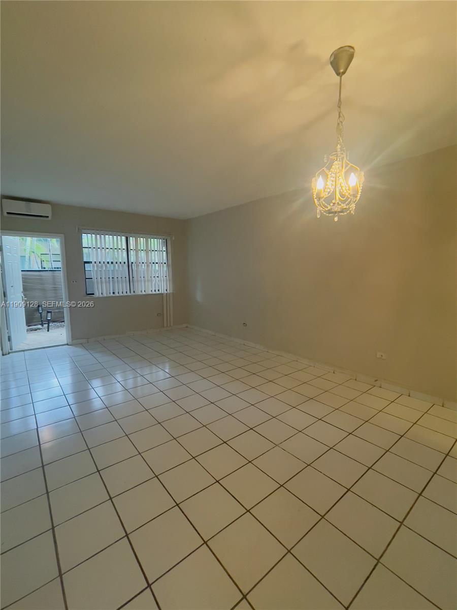 807 86th Street, Unit 805 Miami Beach, FL 33141 - Photo 1 of 10 a view of a room and window