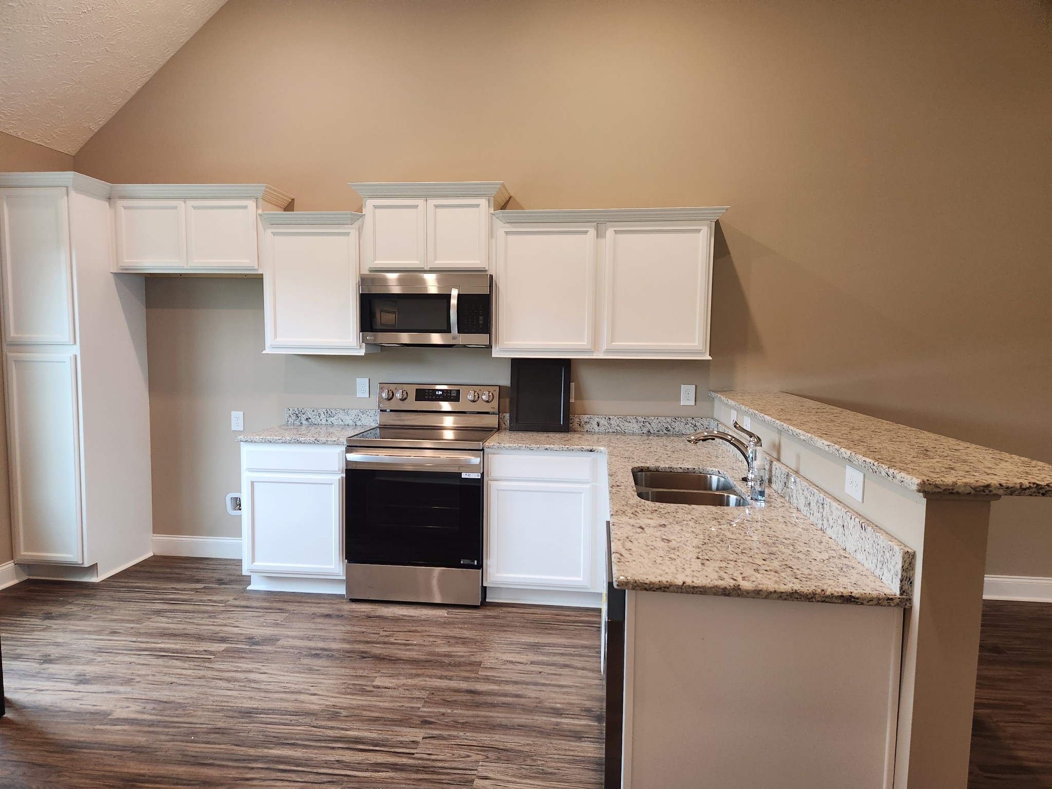 2815 Upstream Road Christiana, TN 37037 - Photo 47 of 61 Kitchen features Stainless Smooth Top Stove, Microwave and Dishwasher. Previous House is shown.