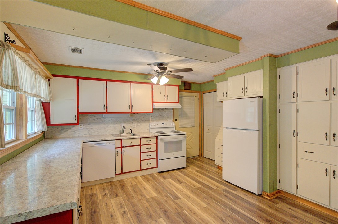 5064 Keowee School Road Seneca, SC 29672 - Photo 16 of 49 This bright kitchen features ample cabinetry and durable flooring, perfect for daily living and entertaining.