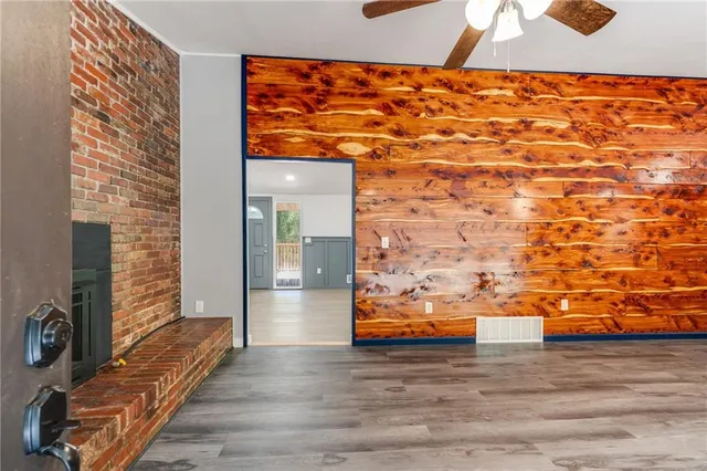 a large kitchen with stainless steel appliances a stove and a refrigerator