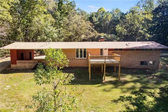 a balcony with table and chairs