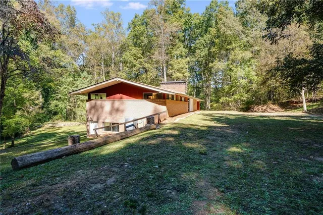 a backyard of a house with lots of green space
