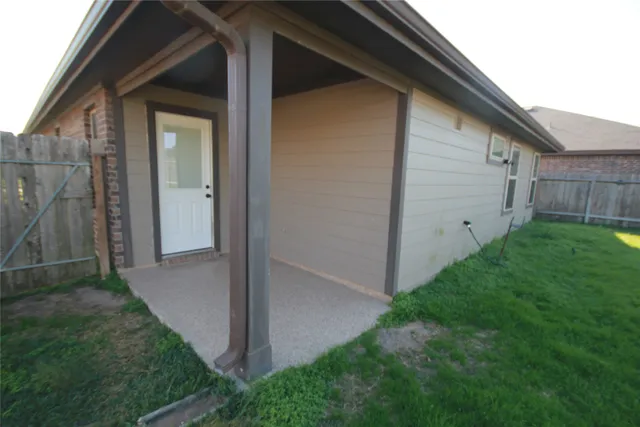 a view of backyard with potted plants