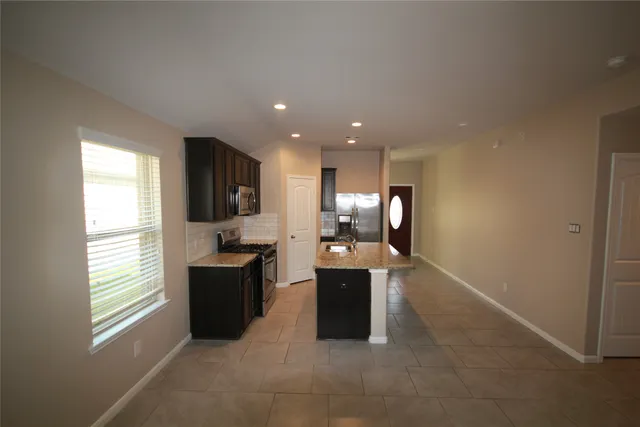a view of living room with furniture and window