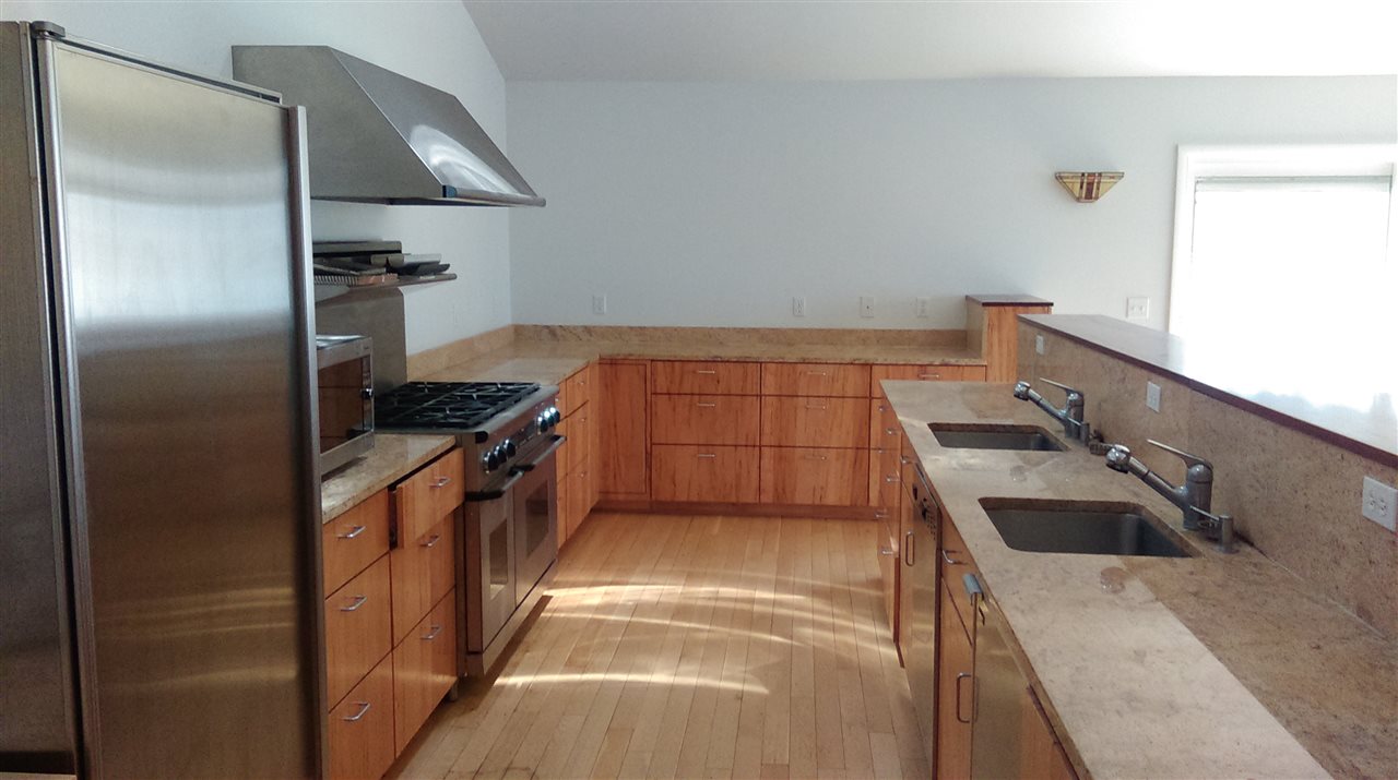 58 Courthouse Mountain Road Madison, VA 22727 - Photo 23 of 37 a kitchen with a sink and a refrigerator