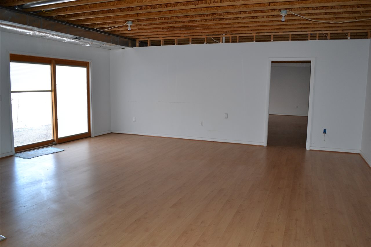 58 Courthouse Mountain Road Madison, VA 22727 - Photo 26 of 37 a view of an empty room with wooden floor and a window