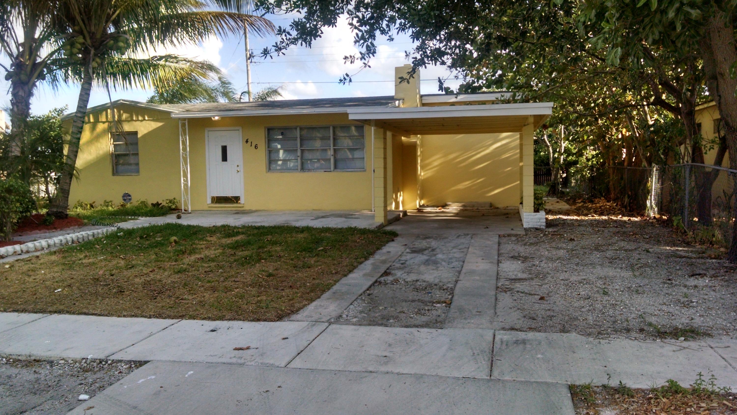 416 Pine Road West Palm Beach, FL 33409 - Photo 1 of 12 Front