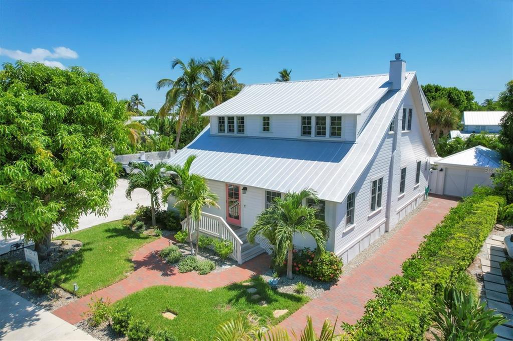 342 Palm Avenue Boca Grande, FL 33921 - Photo 1 of 47 a house with a yard in front of it