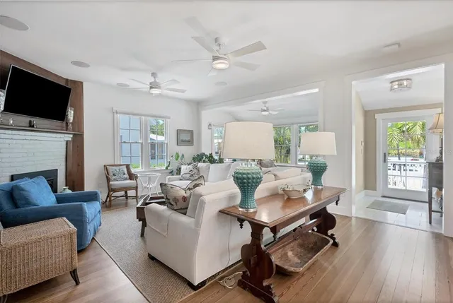 a living room with furniture fireplace and a flat screen tv