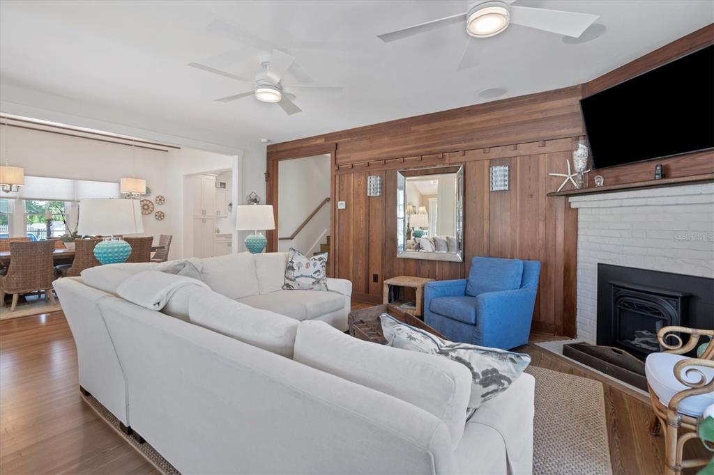 342 Palm Avenue Boca Grande, FL 33921 - Photo 12 of 47 a living room with furniture a flat screen tv and a fireplace