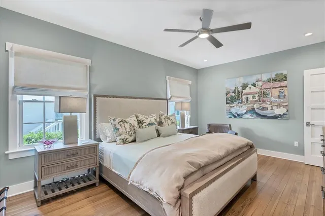 a bedroom with bed and a window