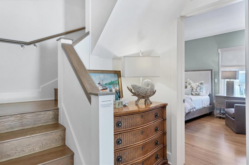 342 Palm Avenue Boca Grande, FL 33921 - Photo 25 of 47 a view of hallway with wooden floor and furniture
