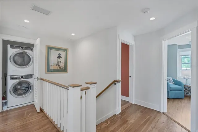 a view of a hallway with washer and dryer