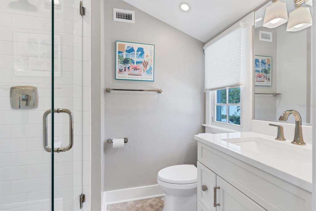 342 Palm Avenue Boca Grande, FL 33921 - Photo 28 of 47 a bathroom with a sink mirror vanity and toilet