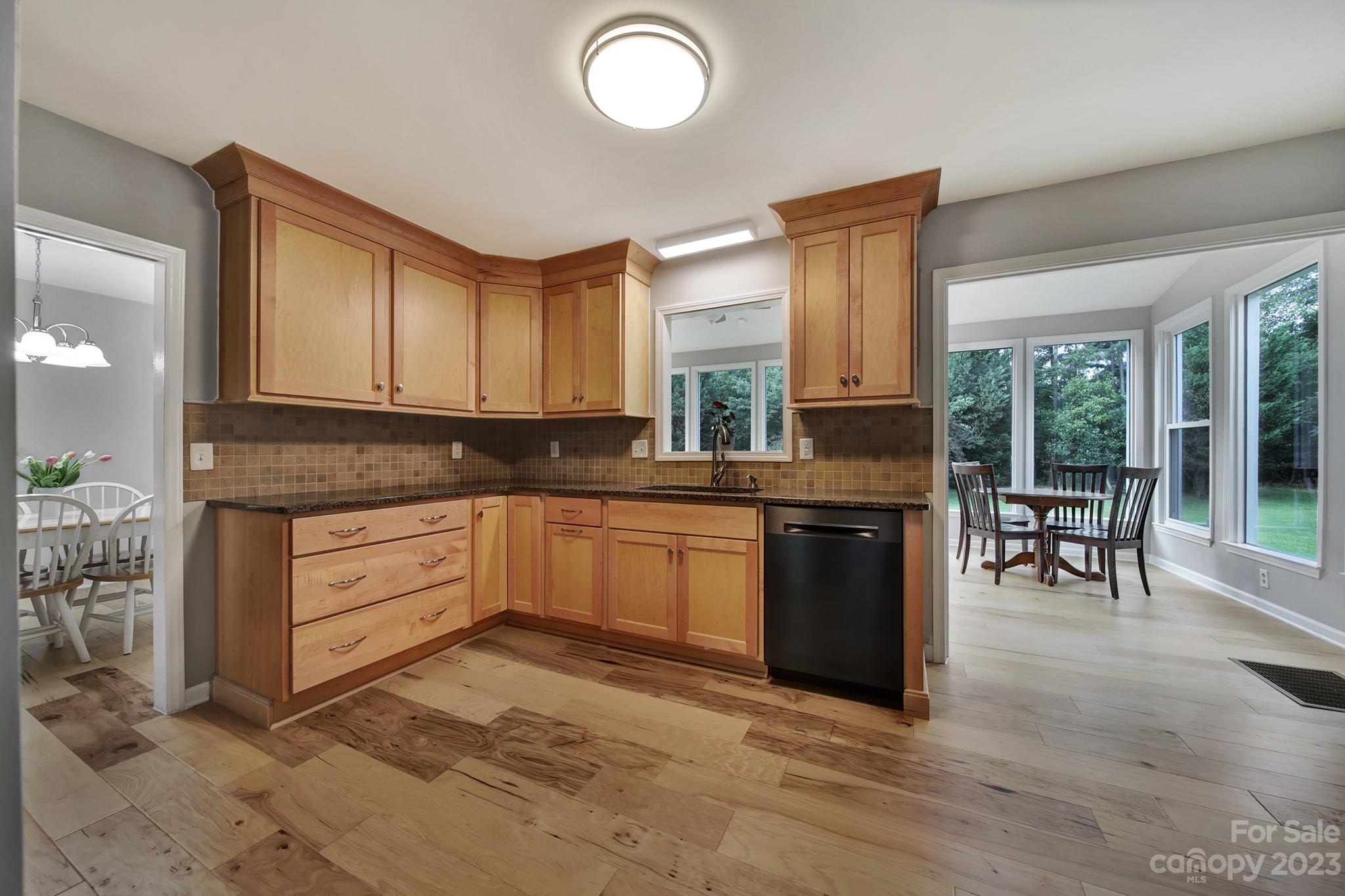 1699 Willowbrook Drive Fort Mill, SC 29708 - Photo 11 of 40 a kitchen with stainless steel appliances granite countertop a stove a sink and a microwave