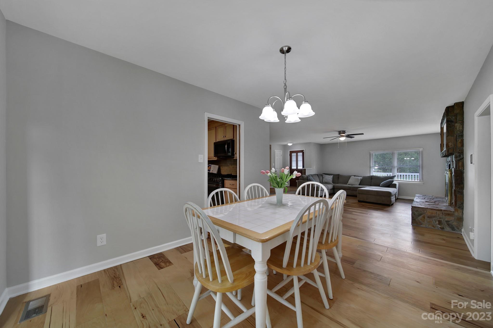 1699 Willowbrook Drive Fort Mill, SC 29708 - Photo 16 of 40 a view of a dining room with furniture and wooden floor