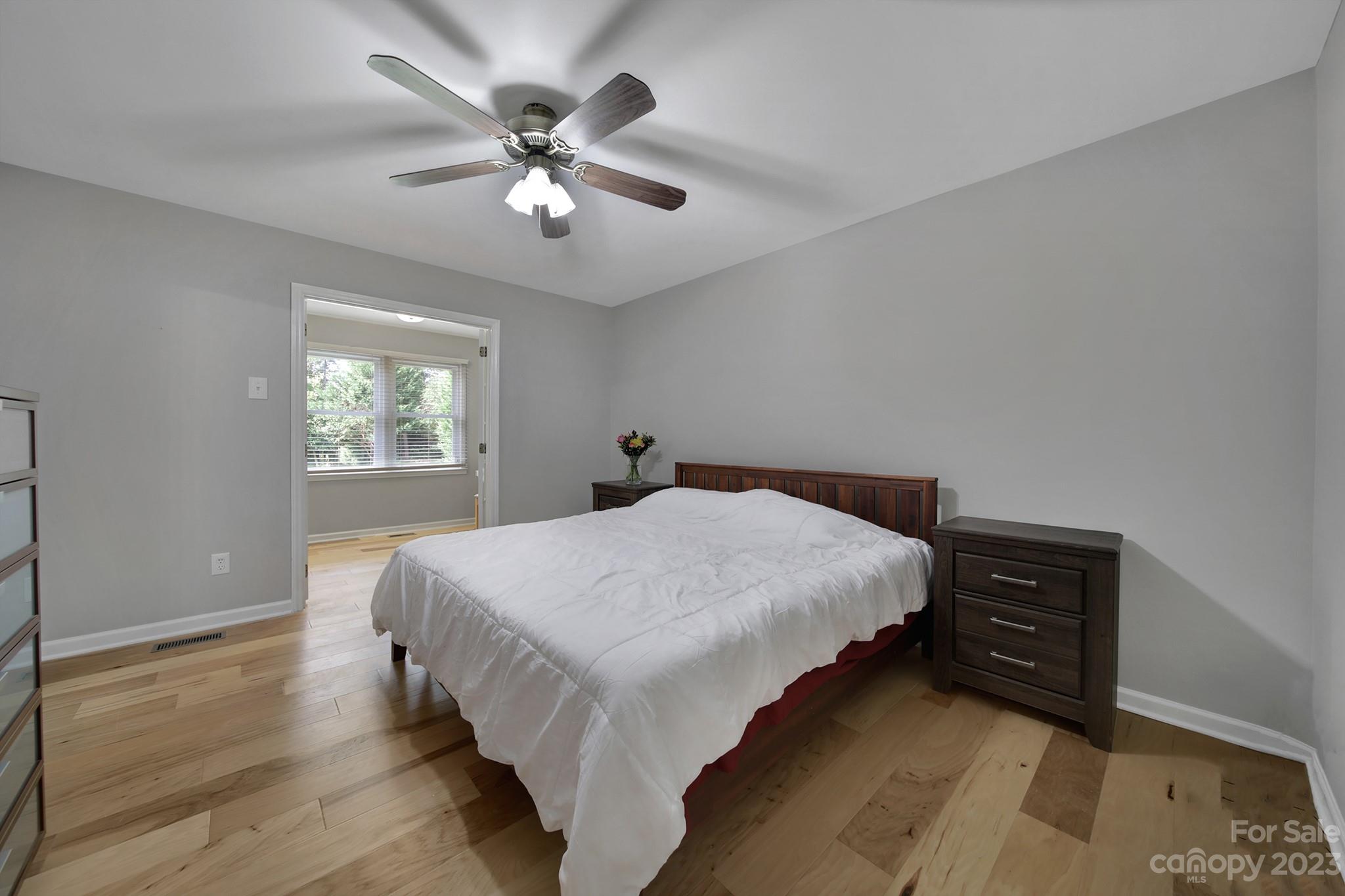 1699 Willowbrook Drive Fort Mill, SC 29708 - Photo 19 of 40 a bedroom with a bed and a chandelier