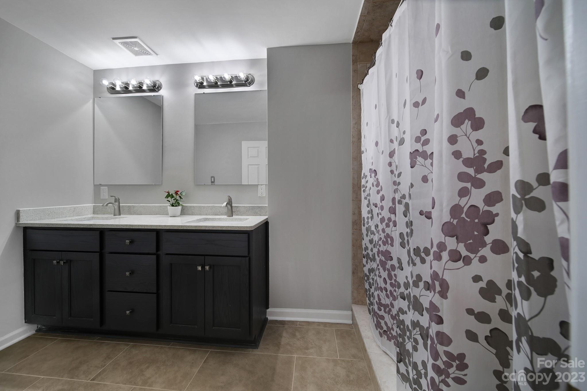 1699 Willowbrook Drive Fort Mill, SC 29708 - Photo 24 of 40 a bathroom with a sink vanity and shower