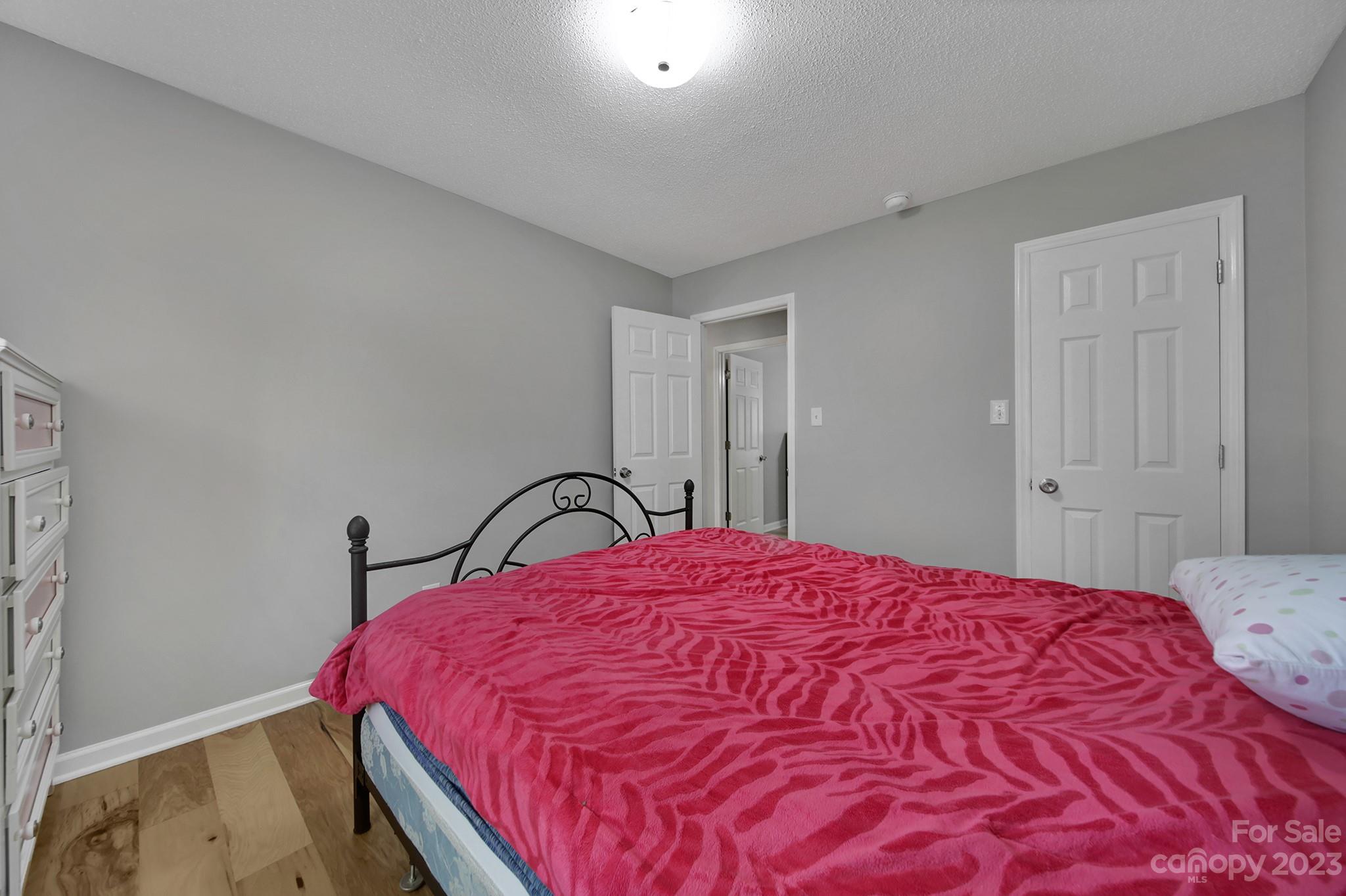 1699 Willowbrook Drive Fort Mill, SC 29708 - Photo 27 of 40 a bedroom with a bed and a dresser