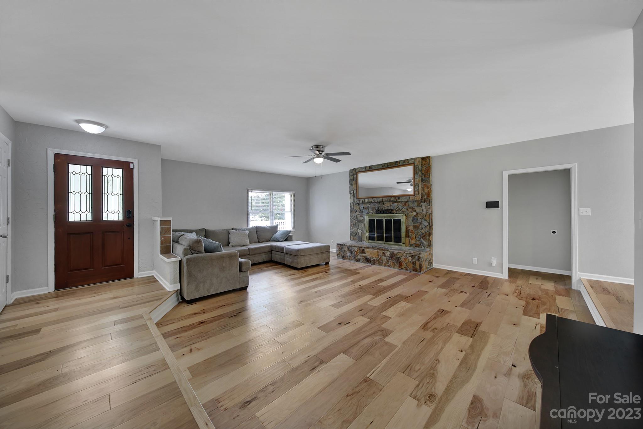 1699 Willowbrook Drive Fort Mill, SC 29708 - Photo 6 of 40 a living room with furniture and a fireplace