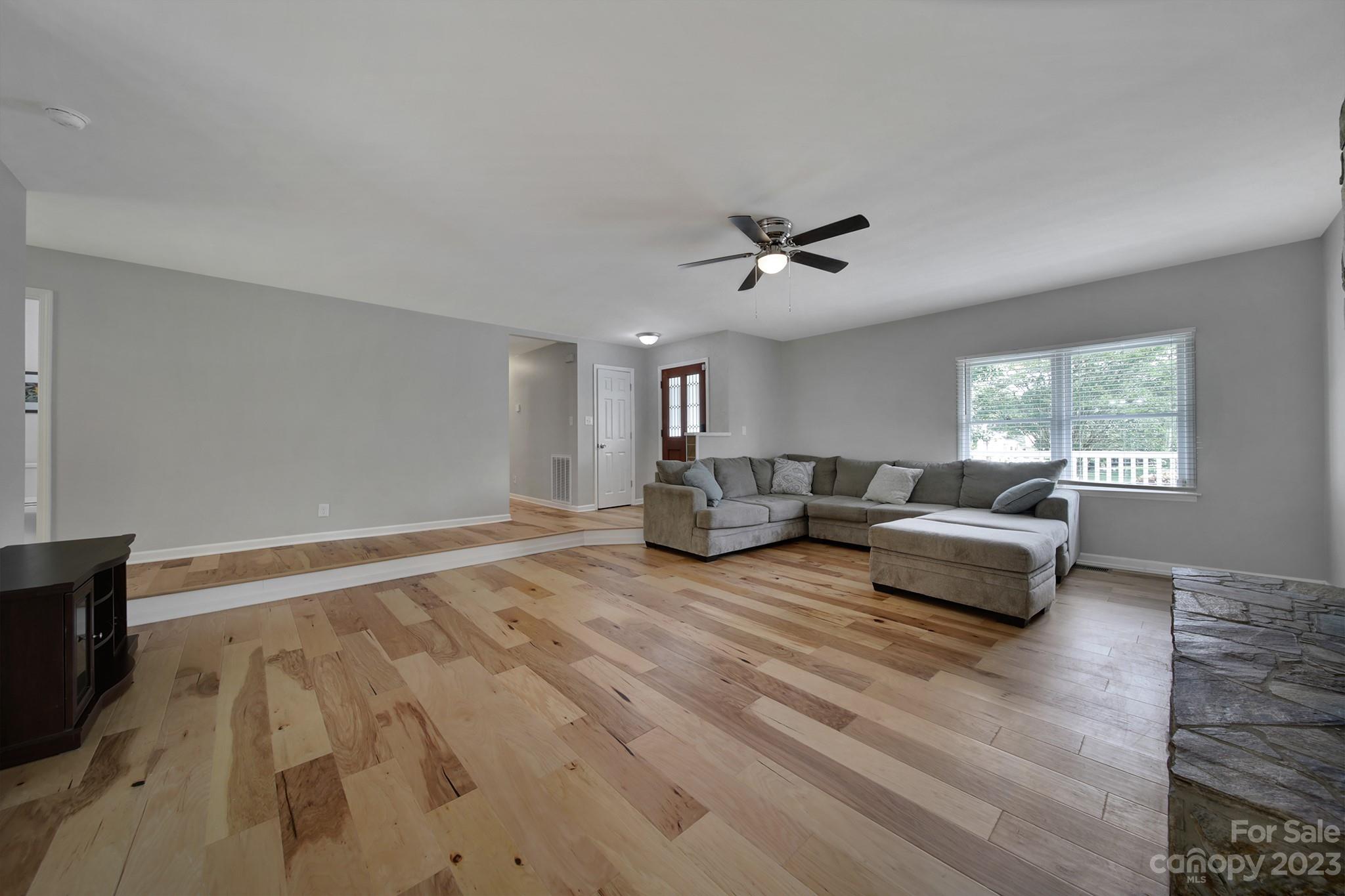 1699 Willowbrook Drive Fort Mill, SC 29708 - Photo 8 of 40 a living room with furniture and a large window