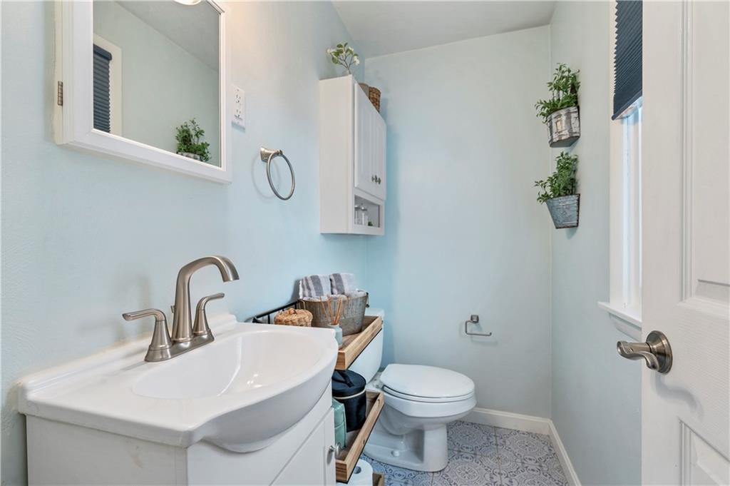 10 Rolling Road Cranberry Township, PA 16066 - Photo 24 of 39 The updated primary ensuite half bath offers a generous size and could be converted to a full bath if desired.