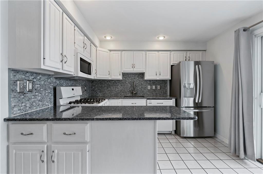 10 Rolling Road Cranberry Township, PA 16066 - Photo 10 of 39 So much counter space! You will appreciate the beauty and durability of the quartz countertops. The attention to detail is evident in this pristine eat-in kitchen!
