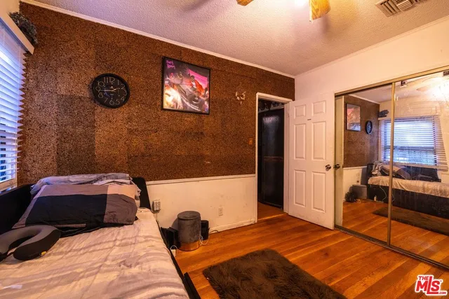 a bedroom with a bed and a table