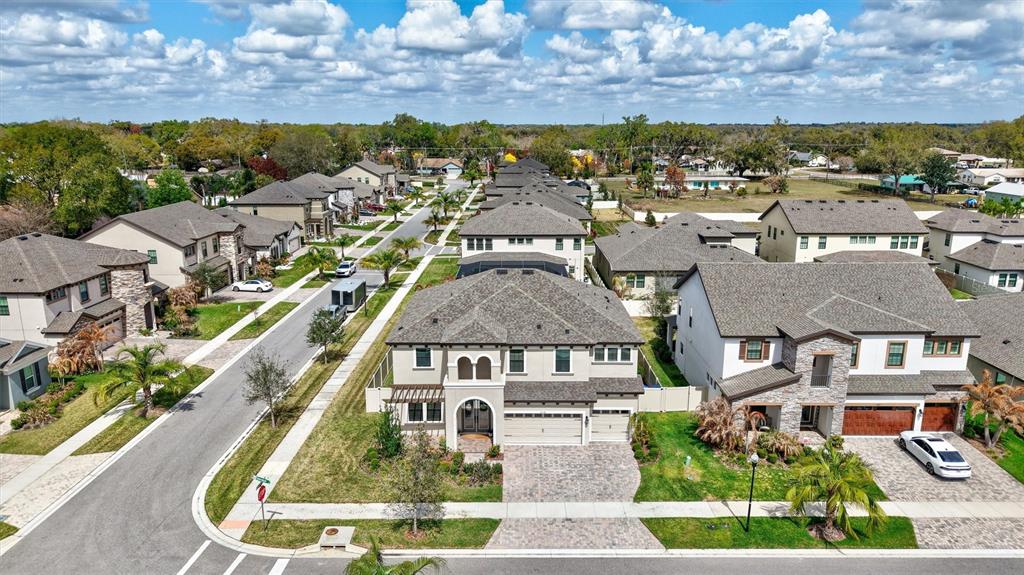 4593 Shoreleaf Loop Valrico, FL 33596 - Photo 2 of 39 an aerial view of multiple houses with a yard