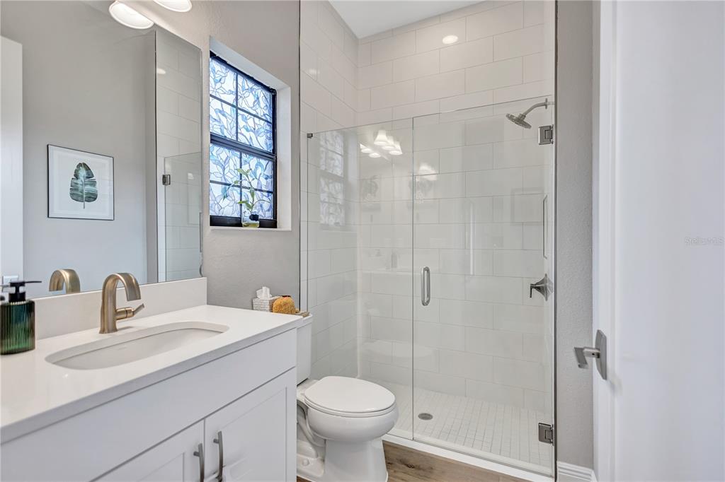 4593 Shoreleaf Loop Valrico, FL 33596 - Photo 30 of 39 a bathroom with a sink toilet and shower