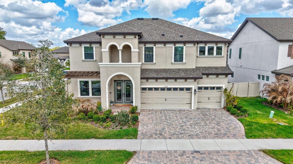 4593 Shoreleaf Loop Valrico, FL 33596 - Photo 39 of 39 a front view of a house with a yard