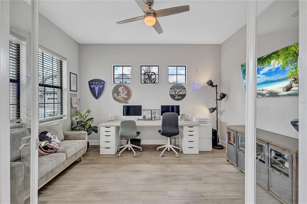 4593 Shoreleaf Loop Valrico, FL 33596 - Photo 4 of 39 a living room with furniture and a flat screen tv
