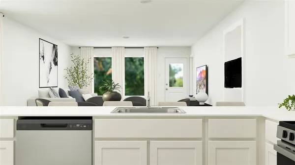 a bedroom with a large bed and a potted plant