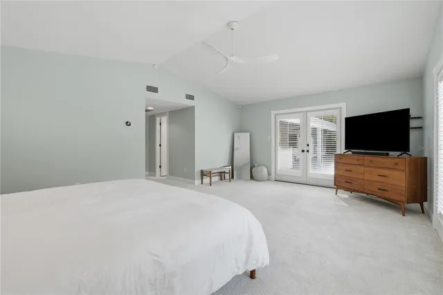a bathroom with a granite countertop sink a shower and a mirror