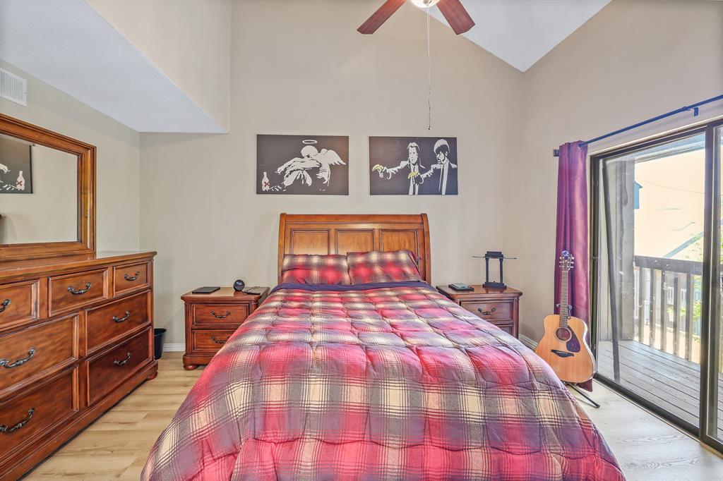 1118 Signal Ridge Place Rockwall, TX 75032 - Photo 12 of 33 a bedroom with a bed and a dresser
