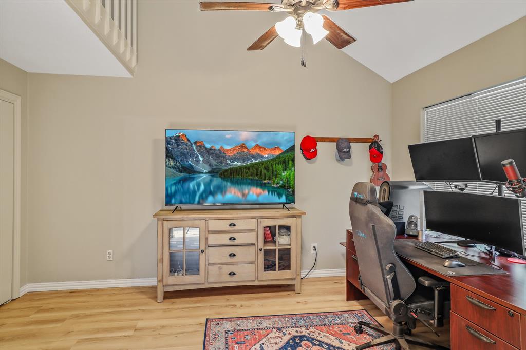 1118 Signal Ridge Place Rockwall, TX 75032 - Photo 18 of 33 a view of a workspace with furniture and wooden floor
