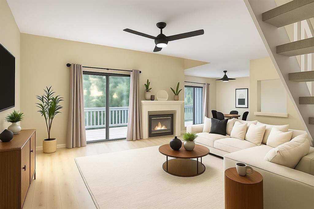 1118 Signal Ridge Place Rockwall, TX 75032 - Photo 3 of 33 a living room with furniture a fireplace and a flat screen tv