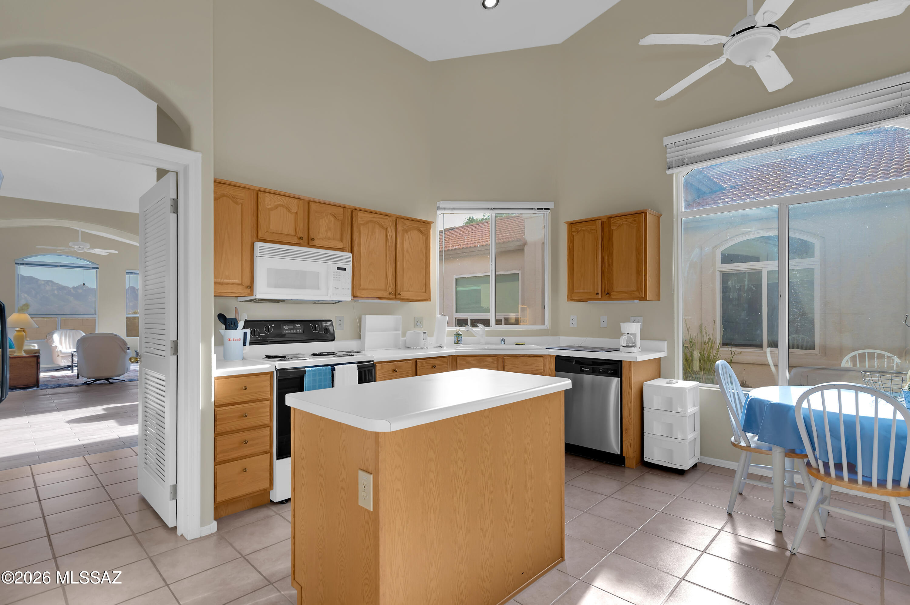 64351 East Wind Ridge Circle Tucson, AZ 85739 - Photo 15 of 41 a kitchen with stainless steel appliances a stove sink and cabinets