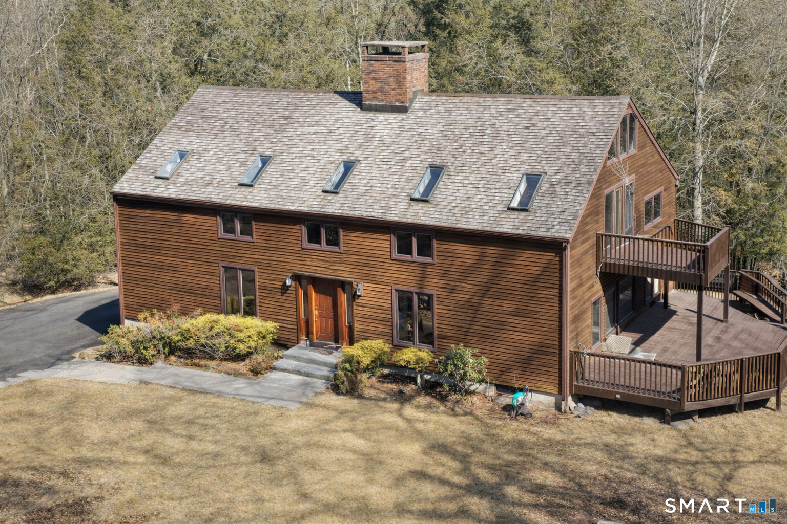 148 Flanders Road Woodbury, CT 06798 - Photo 1 of 1 Drone shot of Front of home. AI was used to remove branches in the photo in front of the house.